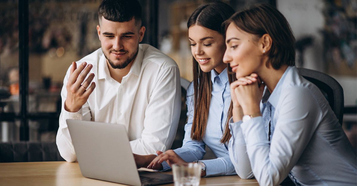 Leaders in Milan discussing financial consulting program pricing